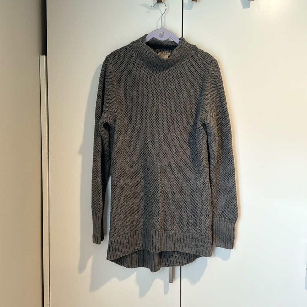 Long grey knit sweater.